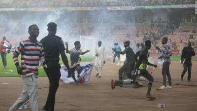 Christian Eriksen - Thomas Partey - Francis Uzoho - Fans storm onto the pitch as Ghana earns World Cup berth over Nigeria - edition.cnn.com - Qatar - Germany - Ghana - county George - Nigeria -  Abuja