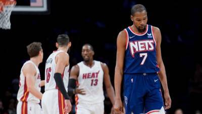 Durant has 31 in return but Heat rally to beat Nets