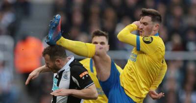 Soccer-Newcastle survive late Brighton onslaught to claim crucial win