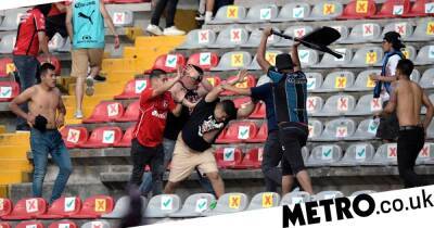 Violent clashes between Queretaro and Atlas fans in Mexico leaves at least 22 injured - metro.co.uk - Mexico -  Santiago