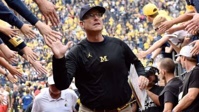 Michigan football coach Jim Harbaugh focused on winning a national title after brief flirtation with NFL return