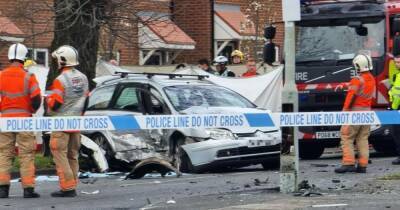 BMW ploughs into garden hedge outside home in Reddish after two-car smash