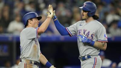 Heim leads Rangers in comeback win over Blue Jays