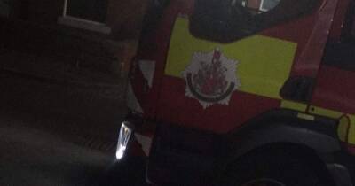 Injured man rushed to hospital after being found unconscious in house fire
