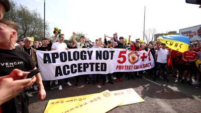 Manchester United fans light flares and chant in protest at club's owners - in pictures