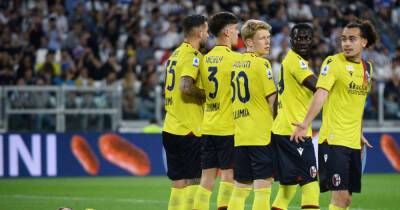 Soccer-Vlahovic earns Juve last-gasp point against depleted Bologna