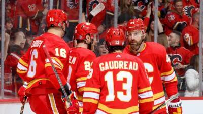 Flames secure playoff berth with a little help from Oilers, then thump Coyotes