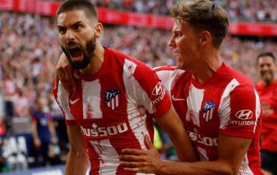 Carrasco scores late penalty to see 10-man Atletico past Espanyol