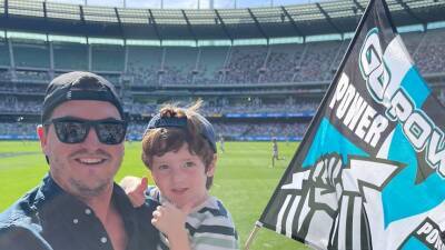 Former AFL player Tom Rockliff says he and his son were spat at by Carlton fans after Port Adelaide loss