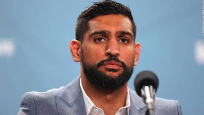 Boxer Amir Khan says he was robbed at gunpoint in London - edition.cnn.com - Britain - Manchester - London