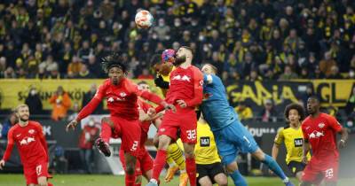 Soccer-Dortmund's title hopes all but dead after 4-1 loss to Leipzig
