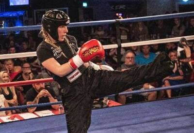 Aylesham teenage kickboxer Ruby Monger of Whitstable Kickboxing celebrates becoming a national champion