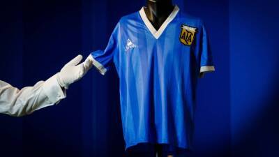 Diego Maradona's 'Hand of God' shirt goes on display in London auction - in pictures