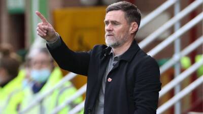 Graham Alexander frustrated in delay moving Rangers game