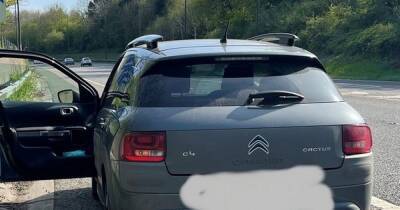 Manchester Airport driver parked on hard shoulder to wait for arrivals