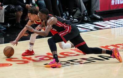 Hawks hold off Heat, Bucks thrash Bulls in NBA playoffs