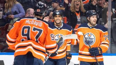 Kane scores hat trick as Oilers clinch playoff spot