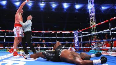 Tyson Fury drops Dillian Whyte in sixth round to retain WBC world heavyweight title in front of 94,000 at Wembley