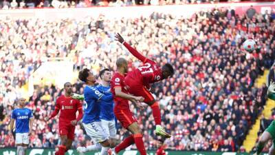 Liverpool back on City's tail after battling past Everton