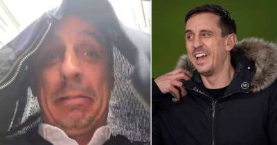 Gary Neville hilariously exits Stamford Bridge with coat over his head