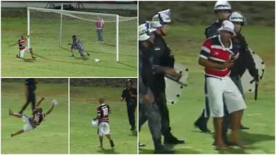 Pitch invader: Fan in Brazil bizarrely tries to show goalkeeper how to dive - givemesport.com - Brazil - county Santa Cruz