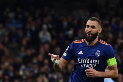 Man City make their Champions League mark but Benzema keeps Madrid alive