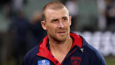 Melbourne AFL premiership trio join Simon Goodwin in missing Hawthorn clash due to COVID-19 isolation - abc.net.au