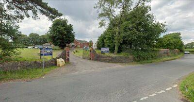 Police close road due to incident outside care home - latest updates