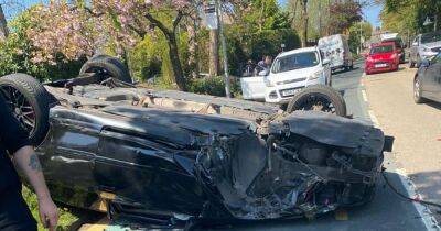 Three men escape with minor injuries as dramatic pictures show car flipped onto roof in Rochdale crash