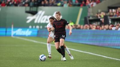 Quinn, OL Reign hand Sinclair, Portland Thorns FC 1st loss in NWSL Challenge Cup
