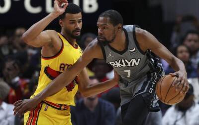 Hawks hold off Nets despite Durant's 55, Warriors into playoffs