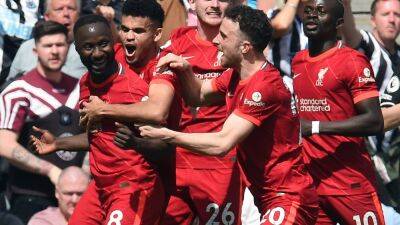 Liverpool maintain quadruple hopes with victory at Newcastle