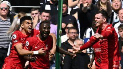 Keita takes Liverpool top with win at Newcastle