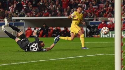 Liverpool beat Benfica after mid-match wobble