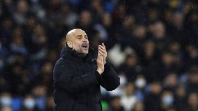 Guardiola says Man City players must keep their cool in Atletico return leg