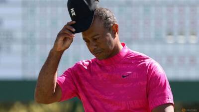 For Woods, pleasure and pain after Masters first round