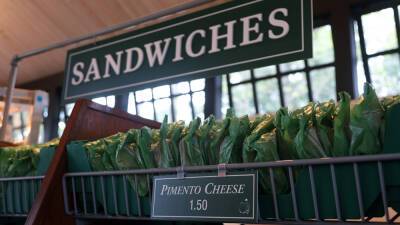Reporter's Notebook: Pimento cheese sandwiches, public phones and lush greens mark golf’s premier event