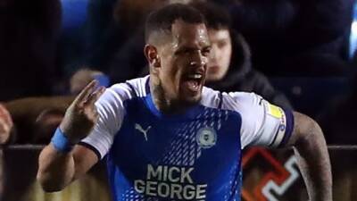 Jonson Clarke-Harris equaliser sees 10-man Peterborough earn Bristol City point