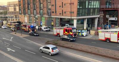 Emergency services called to city centre apartment block after reports of 'people on the roof'