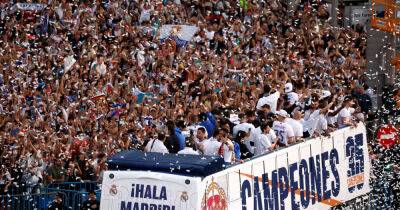 Soccer-Thousands of Real Madrid fans celebrate league title with team