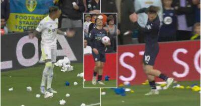 Grealish and Raphinha's different reactions to being pelted by paper balls thrown by Leeds fans