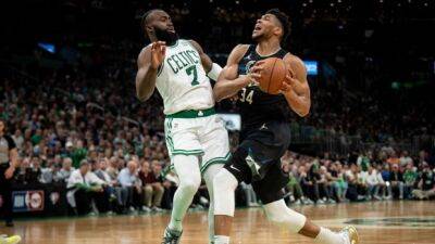 Holiday stops Celtics' last 2 plays to help Bucks take lead in series