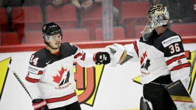 Tim Stutzle - Red Wings - Adam Lowry - Canada hangs on late to beat Germany in men's hockey worlds opener - cbc.ca - Germany - Canada -  Anderson -  Detroit - county Kent - county Logan - county Johnson -  Ottawa - county Morgan