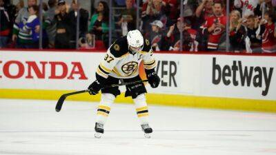 After playoff exit, Bruins await captain Bergeron's decision
