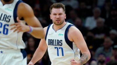 Doncic leads Mavs to blowout of Suns in Game 7