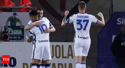 Inter Milan take Serie A title race to final day with victory at Cagliari