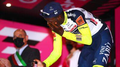 Biniam Girmay taken to hospital after popping champagne cork in his eye after historic Giro d’Italia victory
