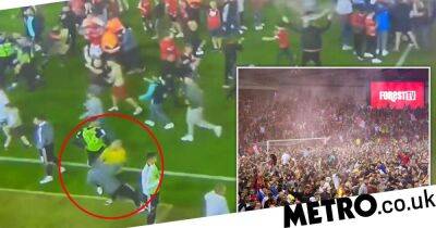 Man arrested for attacking Billy Sharp after Nottingham Forest fans stage mass pitch invasion
