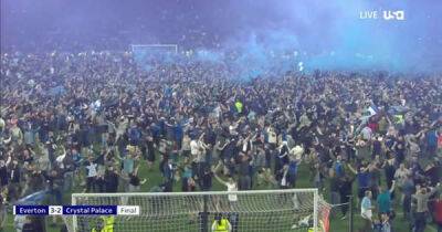 Fans invade pitch as Everton secure Premier League survival