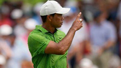 Tiger Woods survives halfway cut to keep US PGA hopes alive